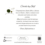 A cat sitting under four sunflowers image 1